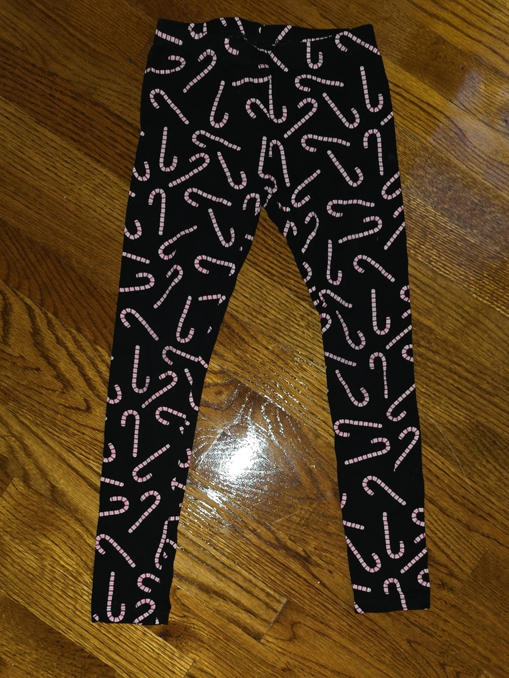 Place Black Leggings with Red And White Candy Cane Print